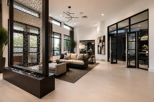 Clubhouse living area with a sectional sofa beside the glass enclosed conference room