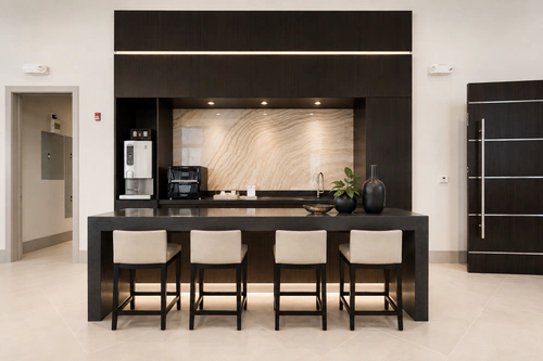 Coffee bar and beverage station with seating for four at The Mayfair Apartments